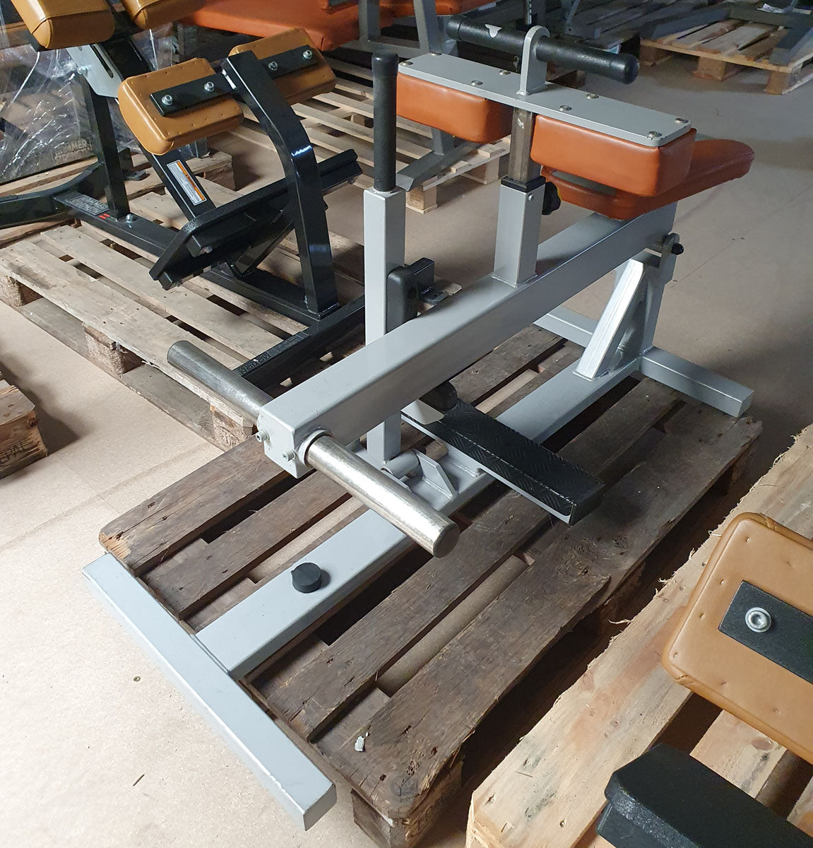 Sportsart calf machine plate loaded, seated calf raise, frame color silver, upholstery color orange, used - refurbished condition