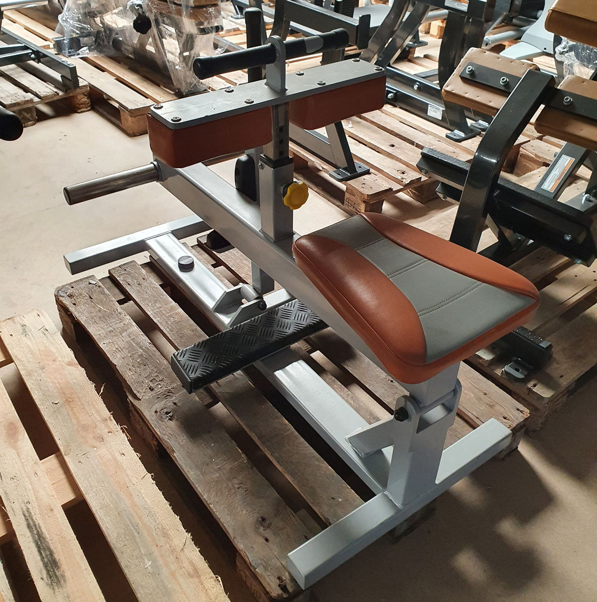 Sportsart calf machine plate loaded, seated calf raise, frame color silver, upholstery color orange, used - refurbished condition