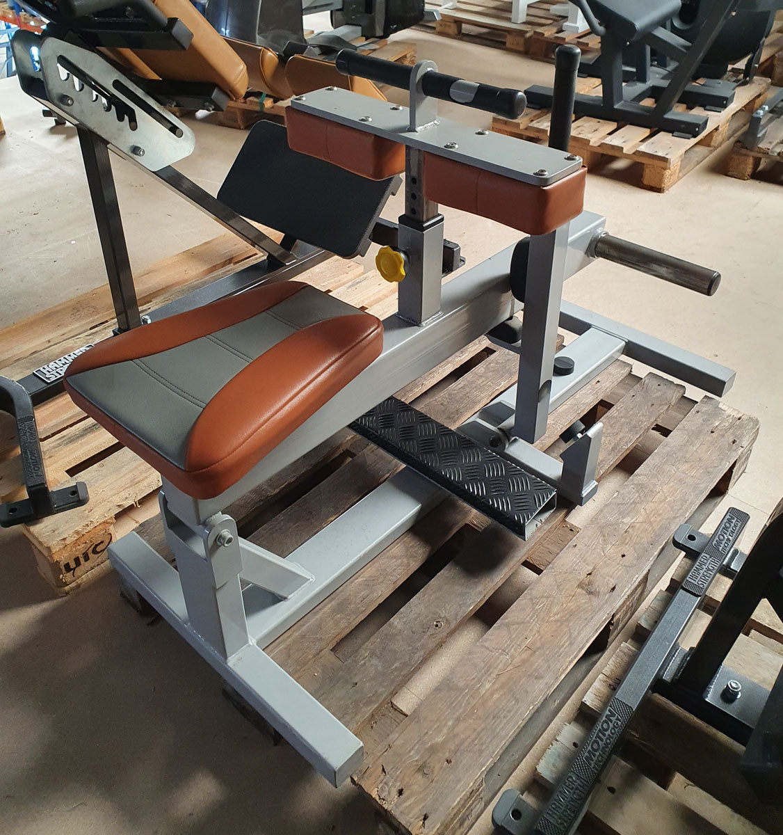 Sportsart calf machine plate loaded, seated calf raise, frame color silver, upholstery color orange, used - refurbished condition