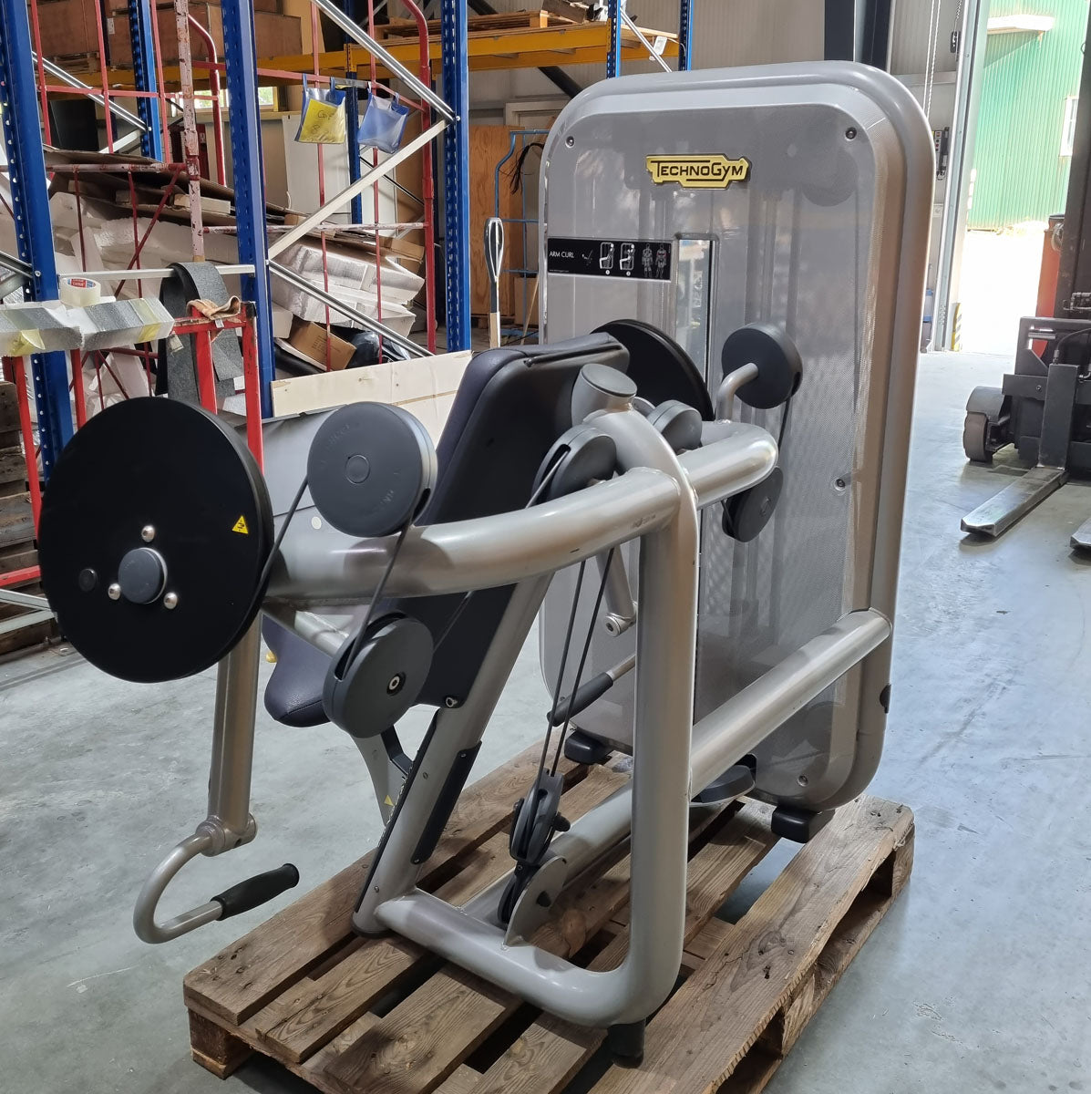 TechnoGym Biceps Machine, Arm Curl, Element Line, frame color silver, upholstery color dove blue, used - refurbished condition