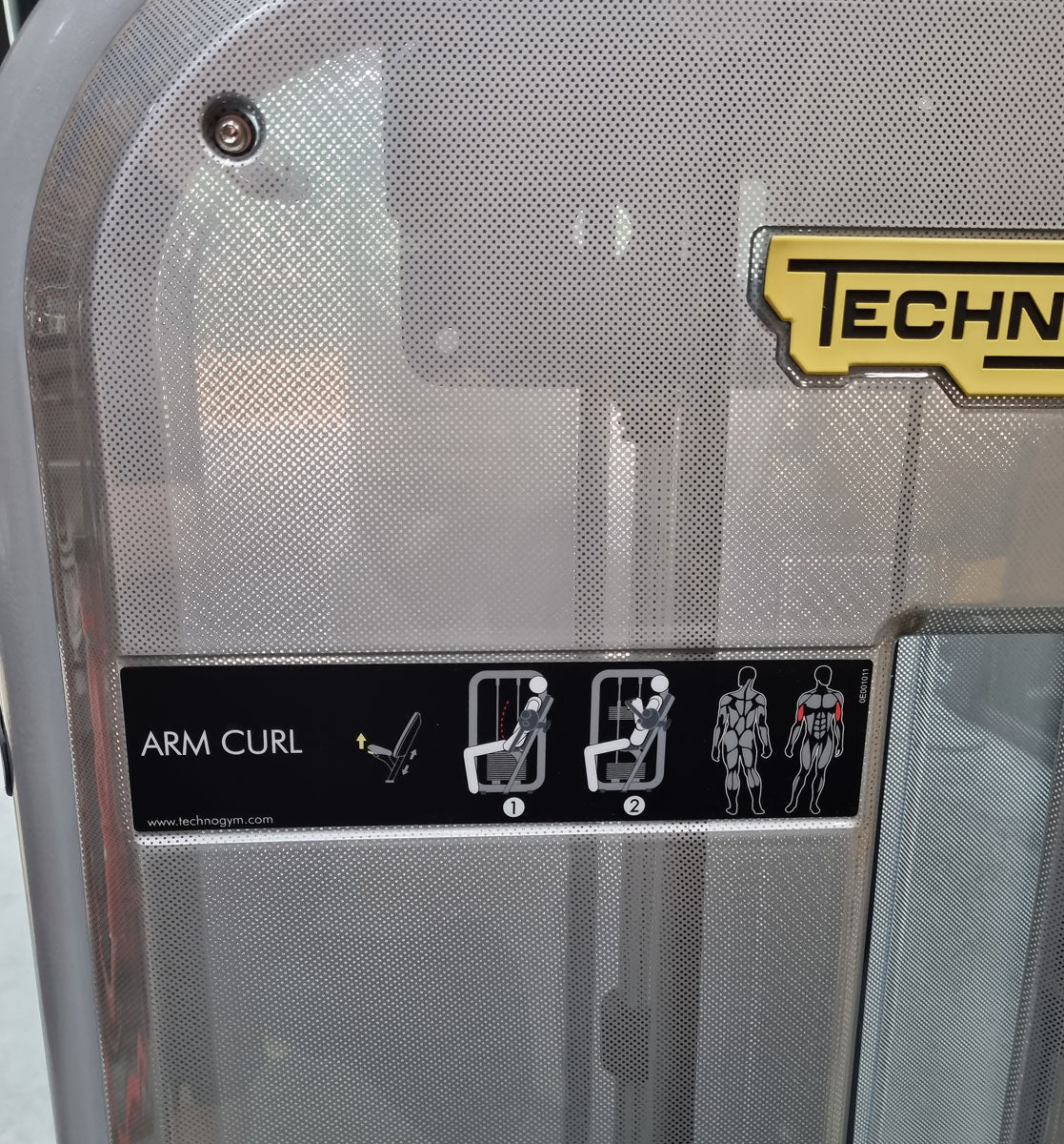 TechnoGym Biceps Machine, Arm Curl, Element Line, frame color silver, upholstery color dove blue, used - refurbished condition