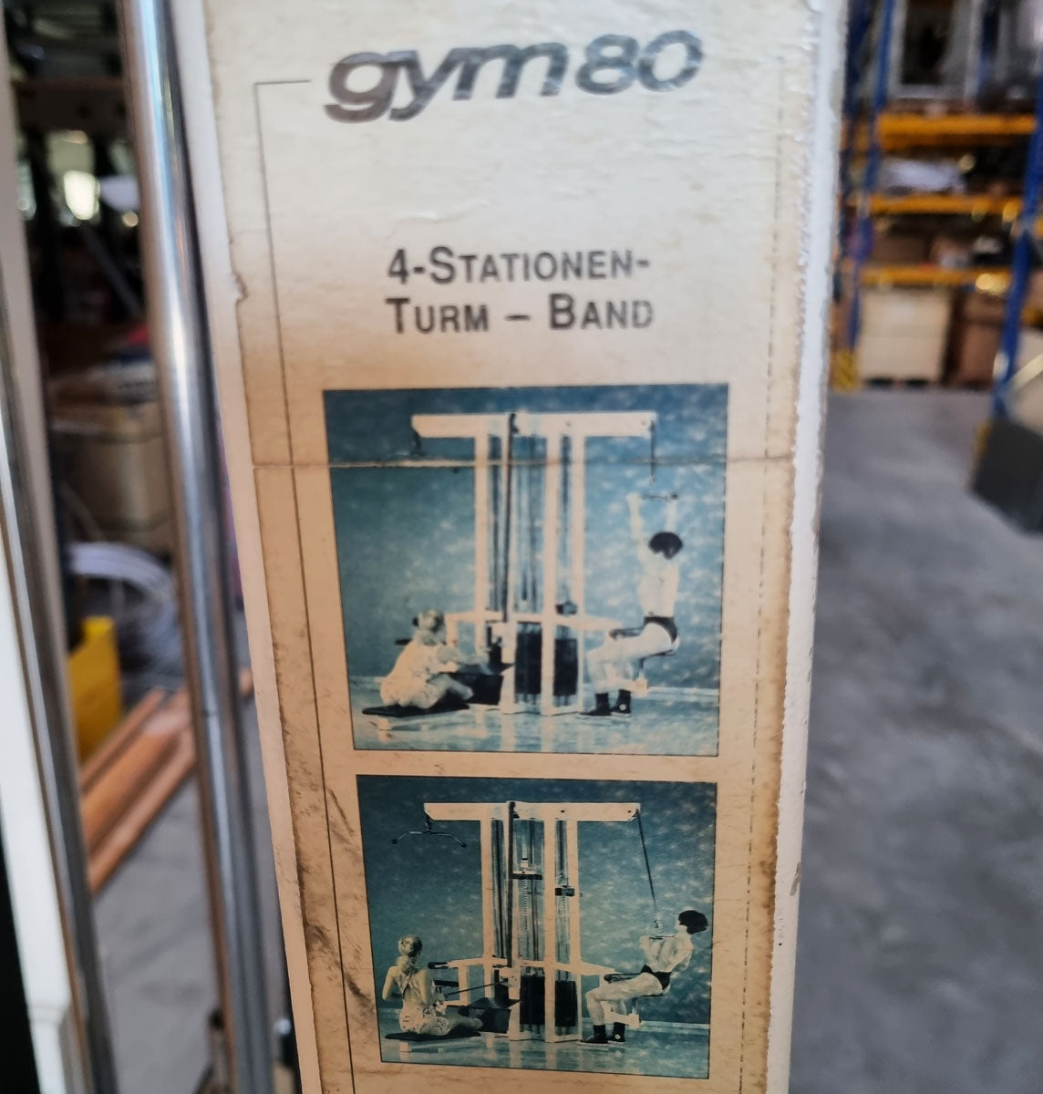 Gym80 - 4-station tower with belt, 4-stack multi-station, large weight blocks, frame color white, upholstery color turquoise, used - refurbished condition