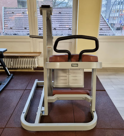 Technogym Pure Rear Kick, gluteus machine, butt machine standing, glute, plate loaded, Pure Strength Series disc holder, frame color silver, used - refurbished condition