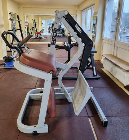 Technogym Pure Rear Kick, gluteus machine, butt machine standing, glute, plate loaded, Pure Strength Series disc holder, frame color silver, used - refurbished condition