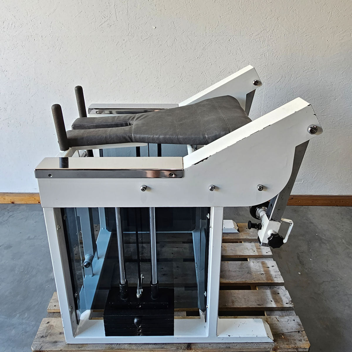 Bruns buttock machine, standing glute machine, glute isolator raise, old school bodybuilding strength machine, white frame, used with signs of wear