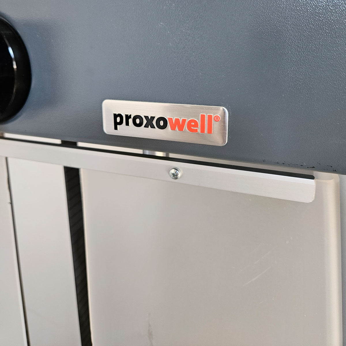 Proxowell or Proxomed bench press machine, chest press, 100kg weight block, Compass or C-Well series, frame color silver, used - refurbished condition