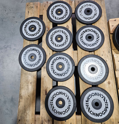 Technogym various weight plates, 230 kg total, 28 mm diameter, cast with rubber outer, 2.5 kg - 5 kg - 10 kg and 20 kg plates, used with signs of wear