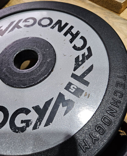 Technogym various weight plates, 230 kg total, 28 mm diameter, cast with rubber outer, 2.5 kg - 5 kg - 10 kg and 20 kg plates, used with signs of wear