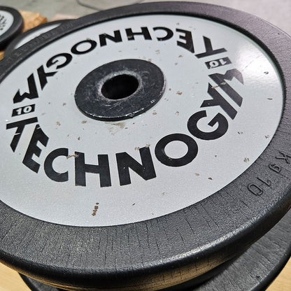 Technogym various weight plates, 230 kg total, 28 mm diameter, cast with rubber outer, 2.5 kg - 5 kg - 10 kg and 20 kg plates, used with signs of wear