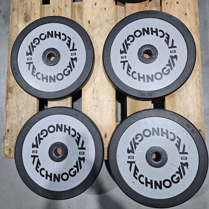 Technogym various weight plates, 230 kg total, 28 mm diameter, cast with rubber outer, 2.5 kg - 5 kg - 10 kg and 20 kg plates, used with signs of wear