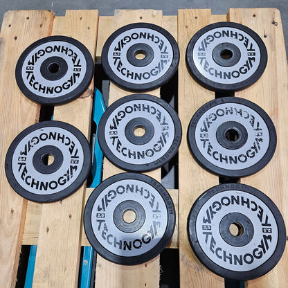Technogym various weight plates, 230 kg total, 28 mm diameter, cast with rubber outer, 2.5 kg - 5 kg - 10 kg and 20 kg plates, used with signs of wear