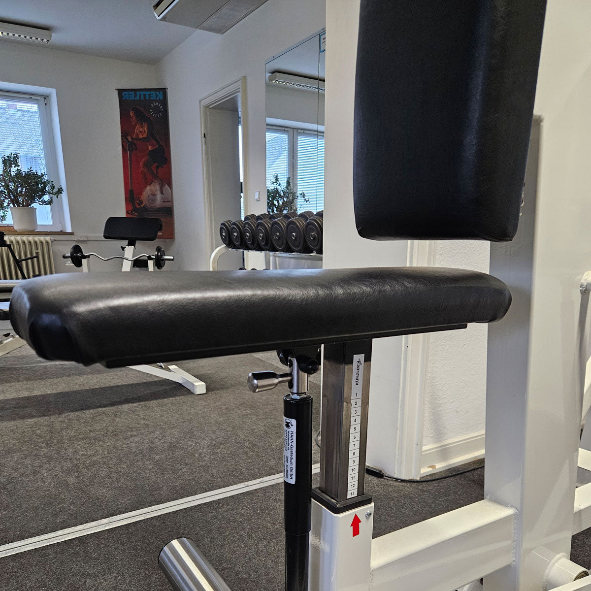 Künzler rowing machine with chest support and entry aid, row, lat rowing, old school bodybuilding strength machine, frame color white, used and tested with signs of wear