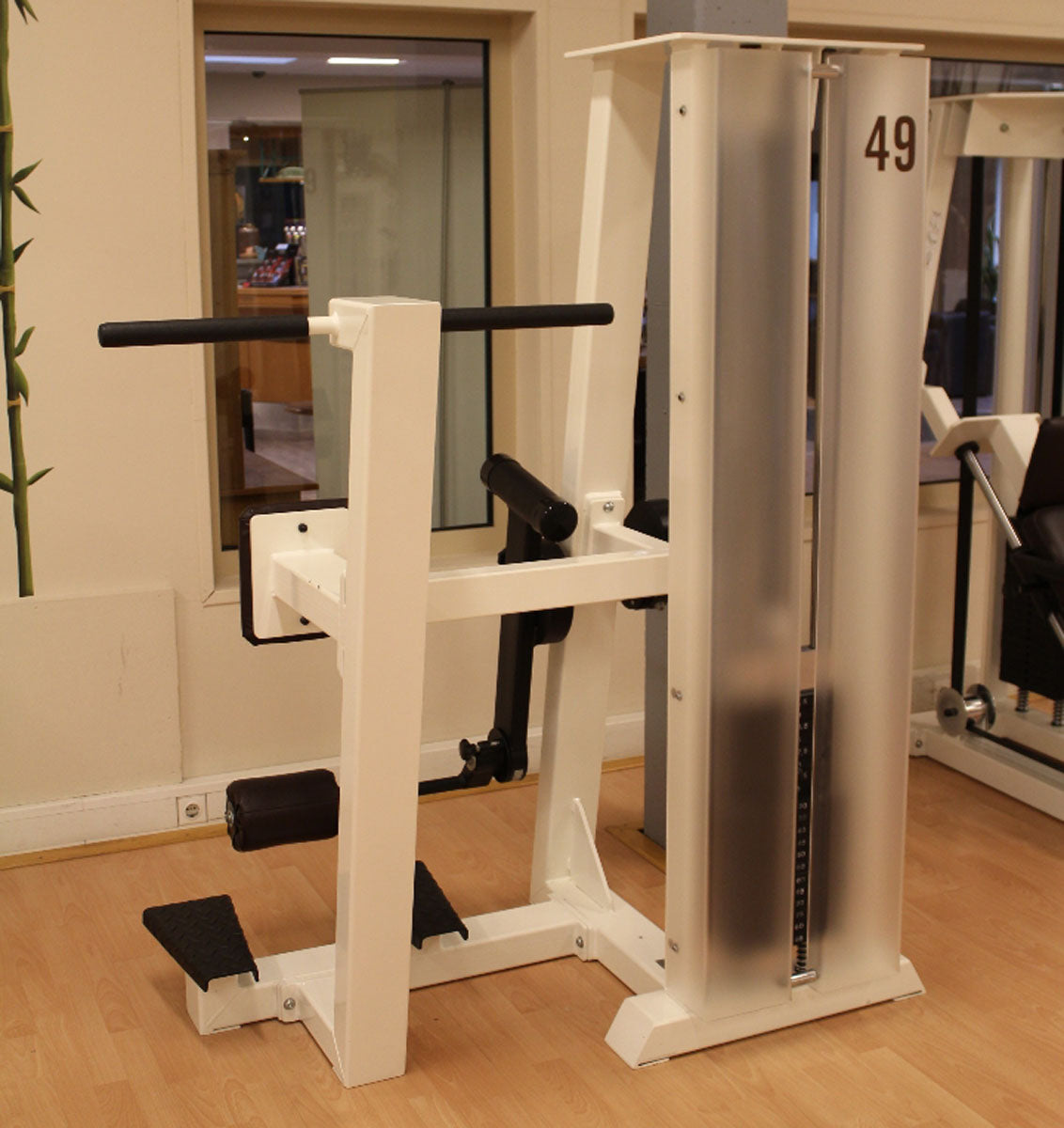 Gym80 Standing Leg Curl, Edition Line, White Frame, Dark Brown Upholstery, Used - Refurbished Condition